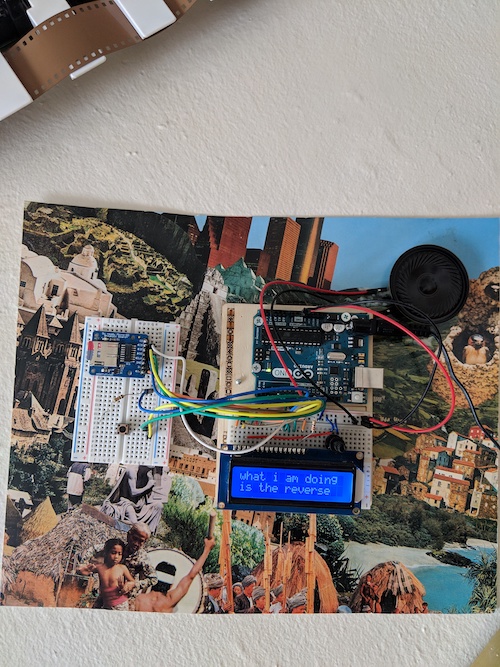 A picture of the arduino device, the screen reads “what i am doing is the reverse”